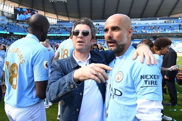 Noel Gallagher speaks to Pep Guardiola.