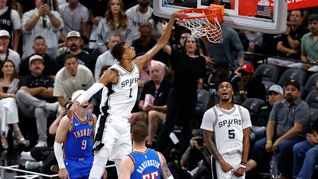 Victor Wembanyama of the San Antonio Spurs dunks the ball against the Oklahoma City Thunder.