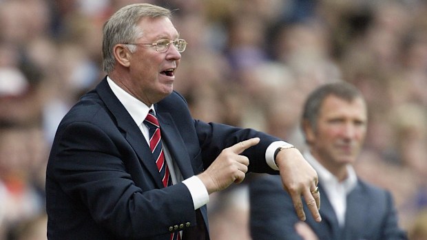 Sir Alex Ferguson, the Manchester United manager, tells the referee to check his watch.