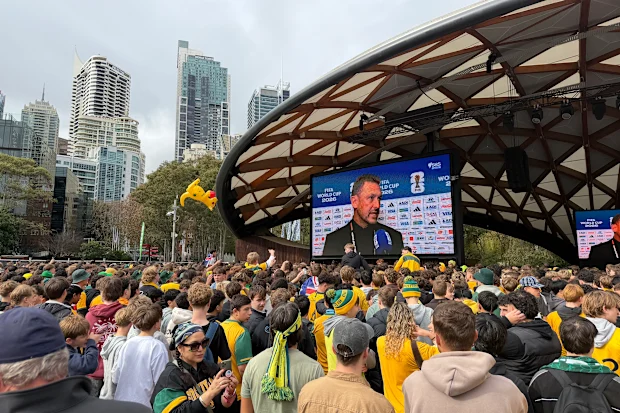 Socceroos fans gather at Sydney's Darling Harbour to secure a spot ahead of kick-off.