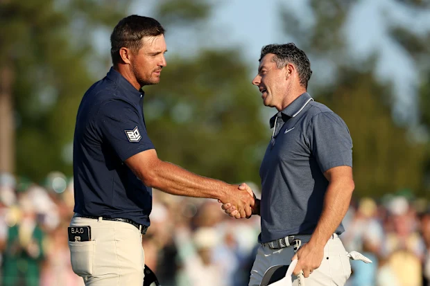 Bryson DeChambeau congratulates Rory McIlroy on his Masters win,