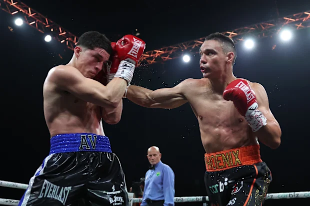 SYDNEY, AUSTRALIA - DECEMBER 17: Tim Tszyu punches Anthony Velazquez during their bout at Tik Tok Theatre on December 17, 2025 in Sydney, Australia. (Photo by Matt King/Getty Images)