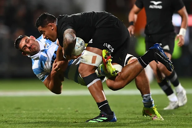 Shannon Frizell of the All Blacks is tackled by Pablo Matera of the Pumas.